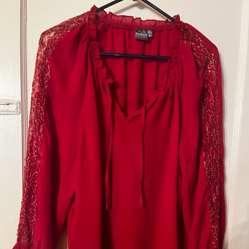 Beautiful red peasant style blouse with Gold embellishment down the sleeves.